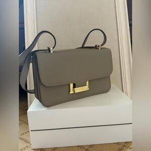 Dove Gray Togo leather structured crossbody flap bag with gold hardware.